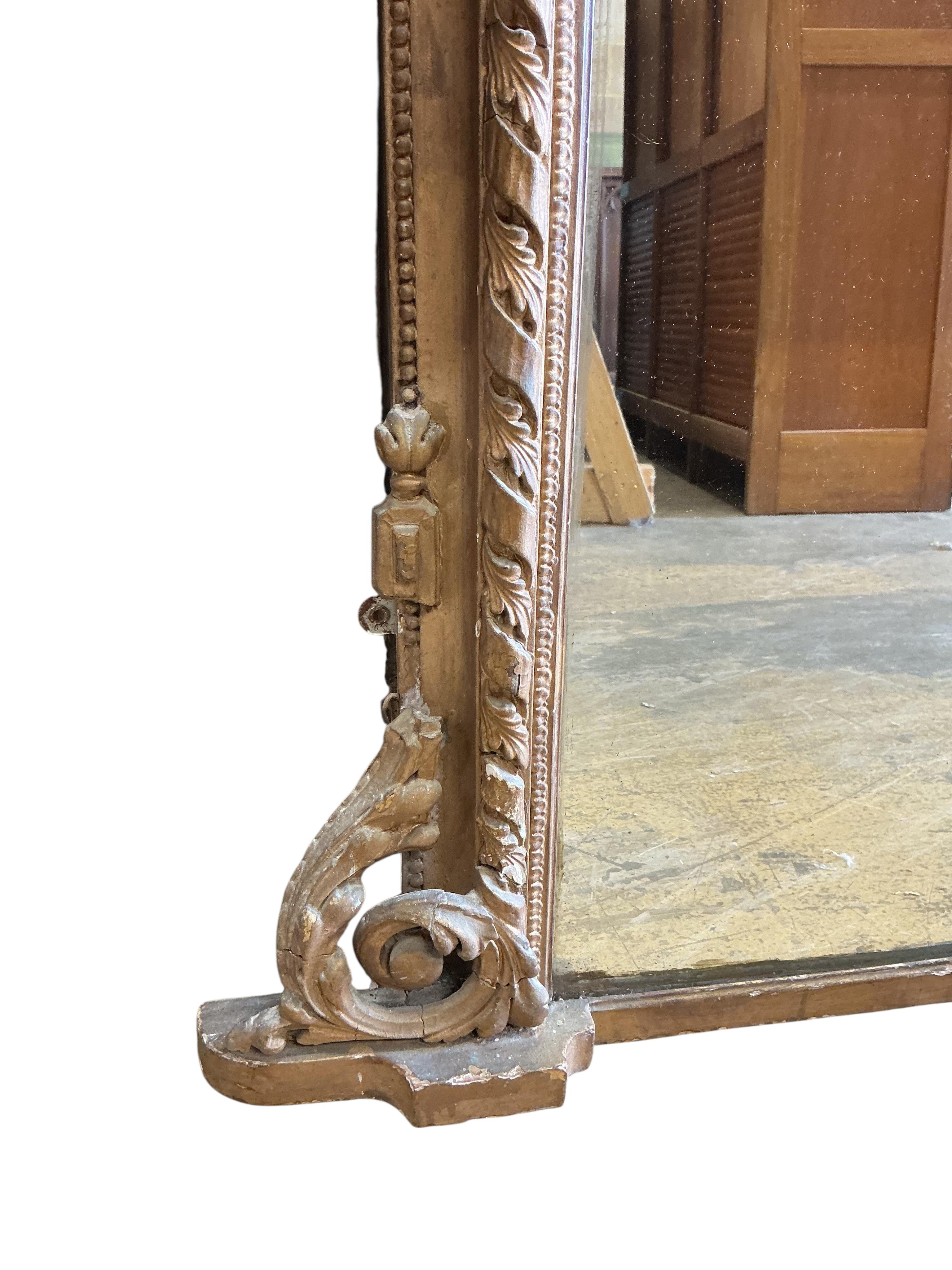 A Victorian giltwood and composition overmantel mirror, width 136cm, height 144cm